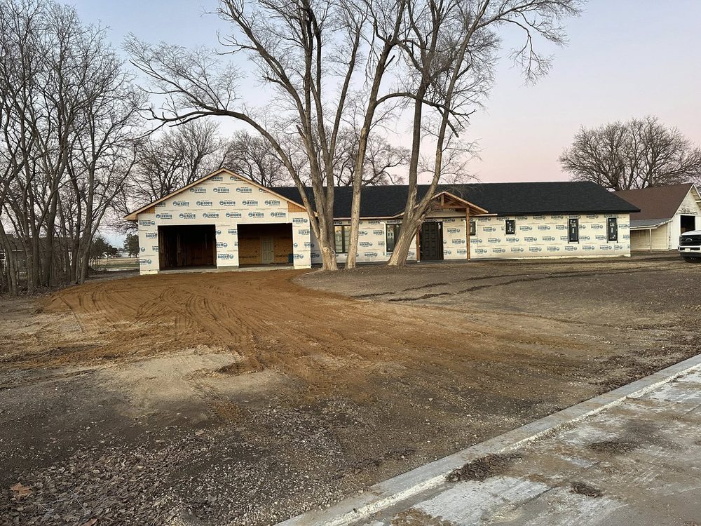 Long ranch home at dusk with warm sunset