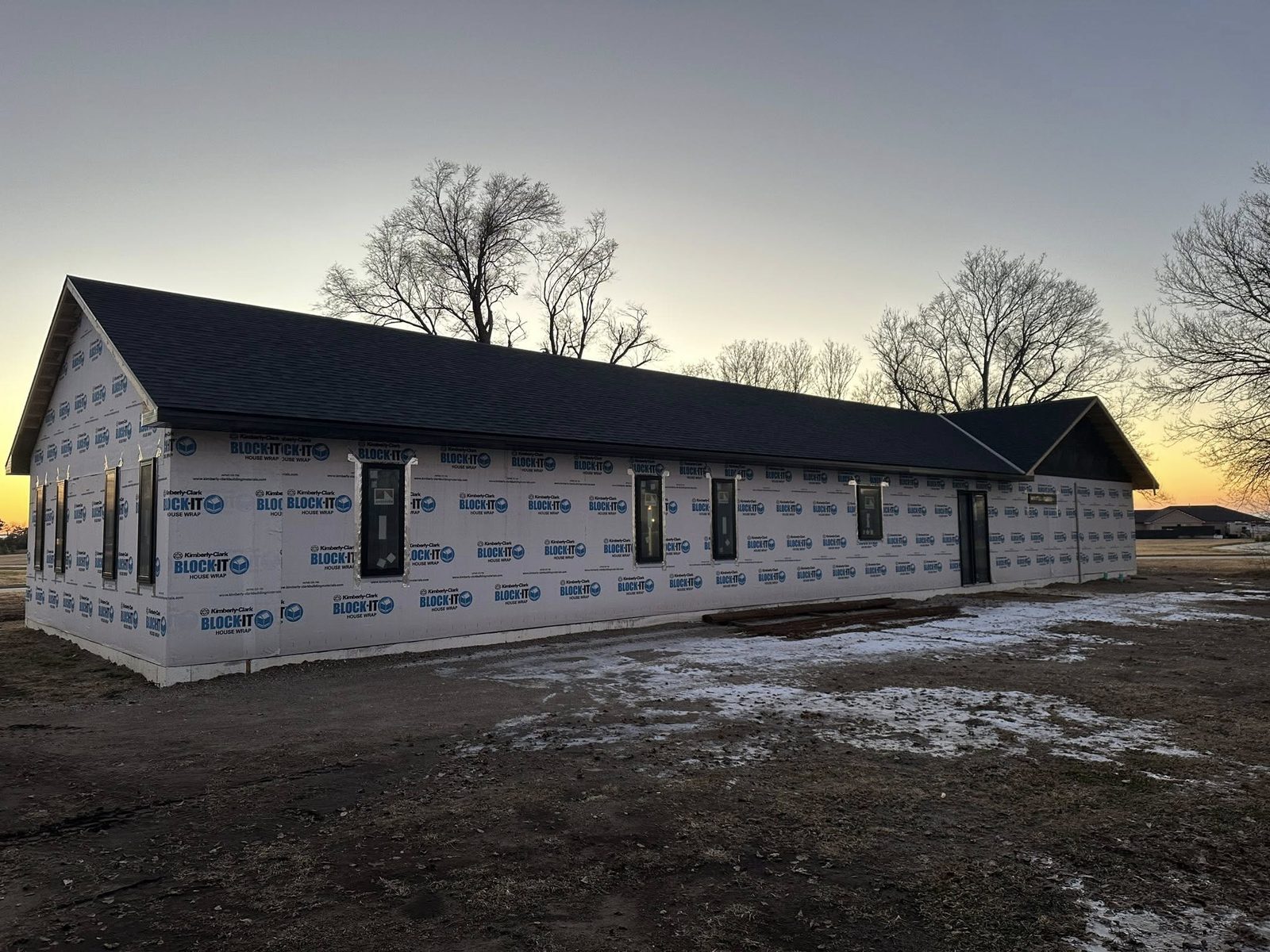 A BlackRidge-built custom home at dusk in rural Nebraska