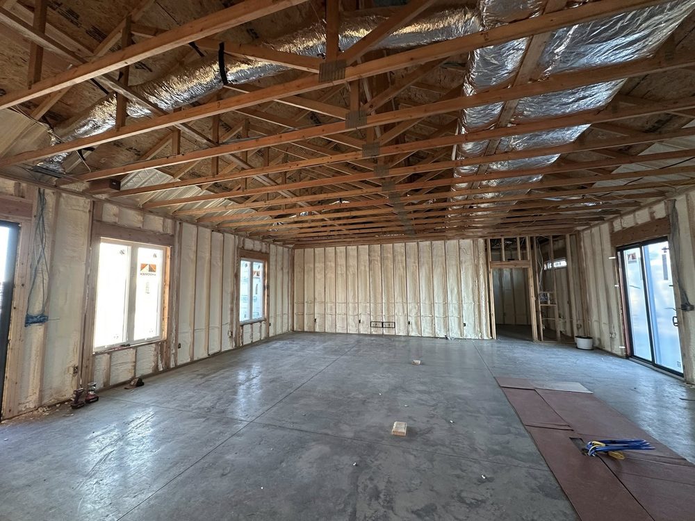Open interior framing with spray foam insulation